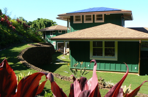 The Hormel house is one of less than two dozen homes on Kaua'i with Photo Voltaic (PV: solar electric panels) and a grid tie-in with 'net metering' Excess electricity generated by the PV panels is sold back to the island electric utility KIUC to run the meter backwards.